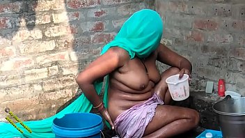 Desi Radhika’s Raw Village Bathing Scene In Hindi