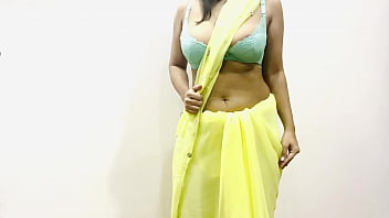 Sensual Indian Bhabhi In Yellow Saree Teasing With Her Voluptuous Curves